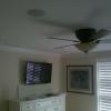 This picture demonstrates a bedroom TV with a pair of in-ceiling speakers