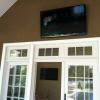 55" LED Mounted outside overlooking a pool. 